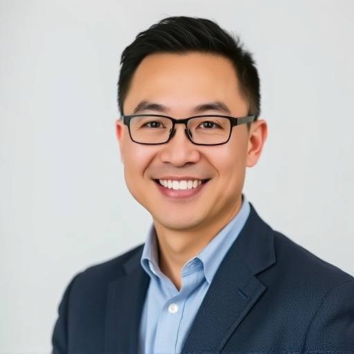 Portrait of David Chen, the Marketing Director at Grand Escapes, smiling confidently.